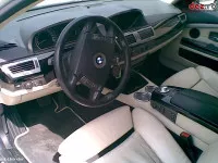 Dezmembram bmw 735i cutii viteze faruri usi capote radiatoare bari 